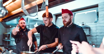 Image of a kitchen featuring hospitality staff