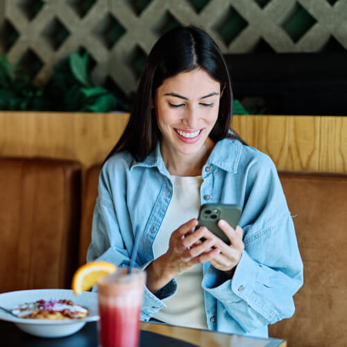 Happy customer check loyalty app in venue
